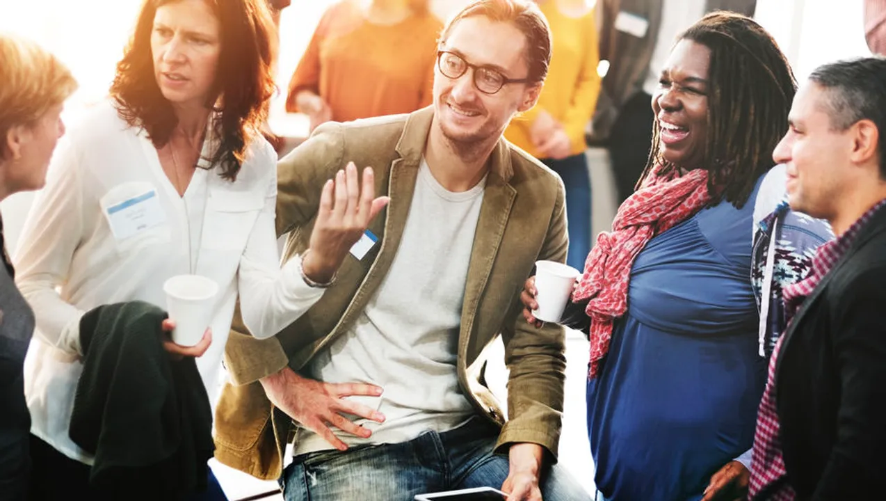 A group of people gathered at a healthcare recruiting event