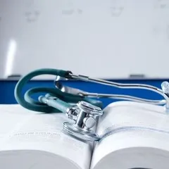 Stethoscope on medical text book