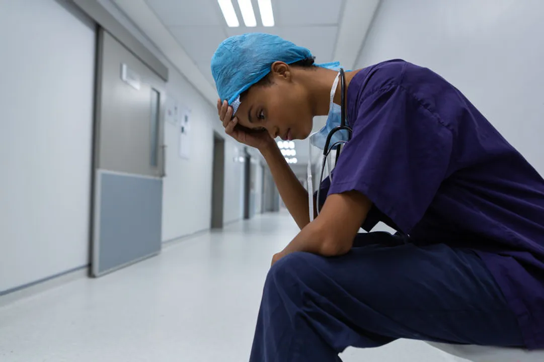 A picture of a nurse or physician suffering from anxiety in a hospital