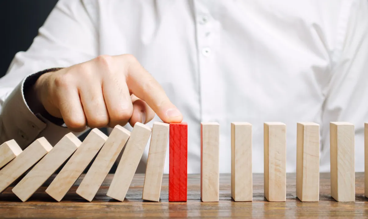 A practice manager stops dominoes from falling.