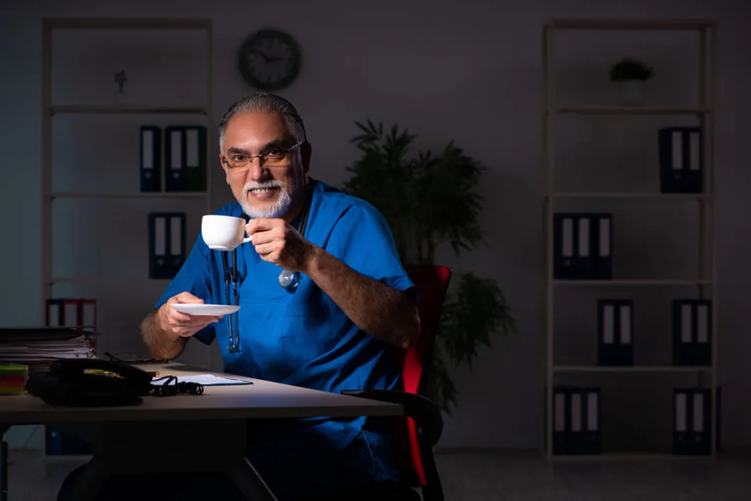 A night shift physician enjoying a coffee break